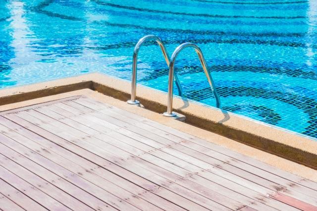 The Importance of Using a Swimming Pool Deck Sealer cover picture