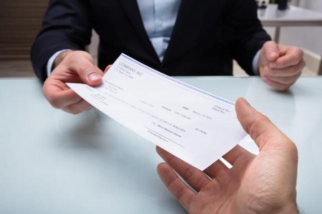 How to Know If Your Business Should Outsource Check Printing cover picture