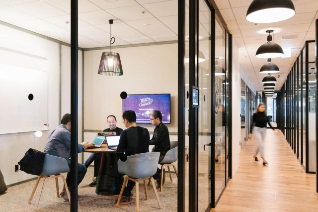 How do Coworking Spaces Facilitate the Balance Between Employee Well-Being and Management Issues?