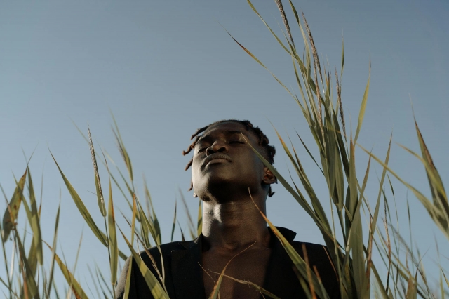  A man standing near the grass