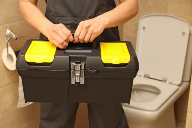 Calling a Professional Plumber for a Toilet Leaking at the Base