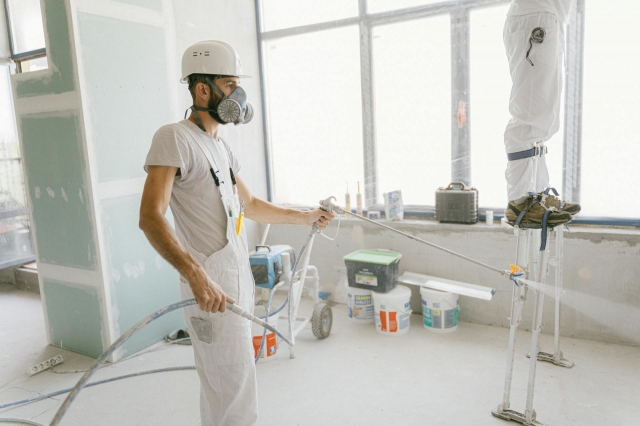 Photo by Antoni Shkraba Studio: https://www.pexels.com/photo/man-in-white-t-shirt-wearing-hard-hat-using-a-hose-to-wash-the-house-5493664/