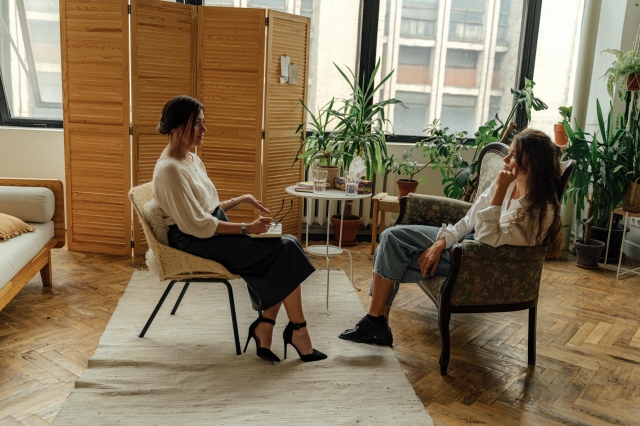 Photo by Antoni Shkraba Studio: https://www.pexels.com/photo/woman-in-white-shirt-sitting-on-chair-5217851/