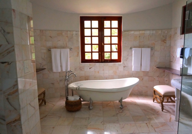 Photo by William LeMond: https://www.pexels.com/photo/white-bathtub-on-white-tile-bathroom-near-brown-framed-clear-glass-window-105934/