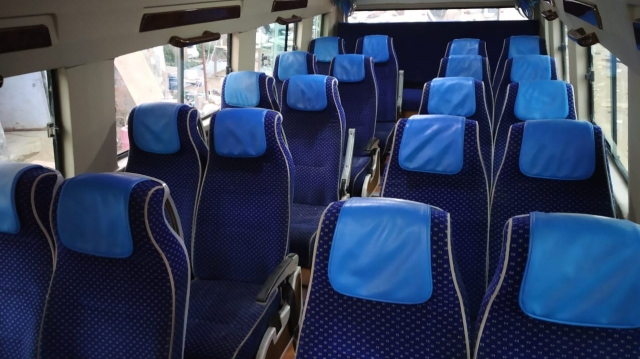 What is the price of 27 seater bus on Rent in Delhi?