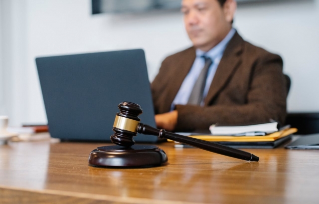 Photo by Sora Shimazaki: https://www.pexels.com/photo/crop-asian-judge-working-on-laptop-in-office-5668772/