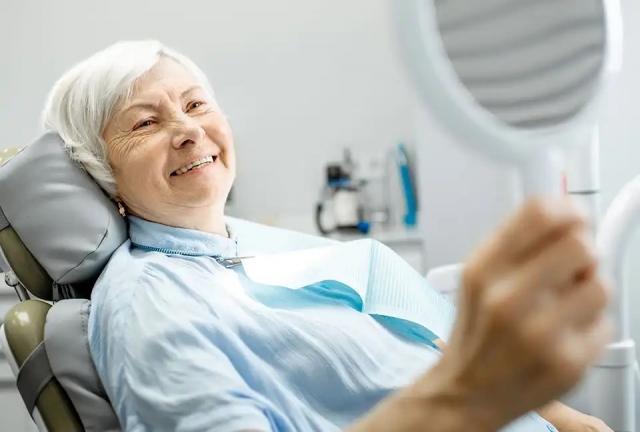 happy woman with new Dental Implants