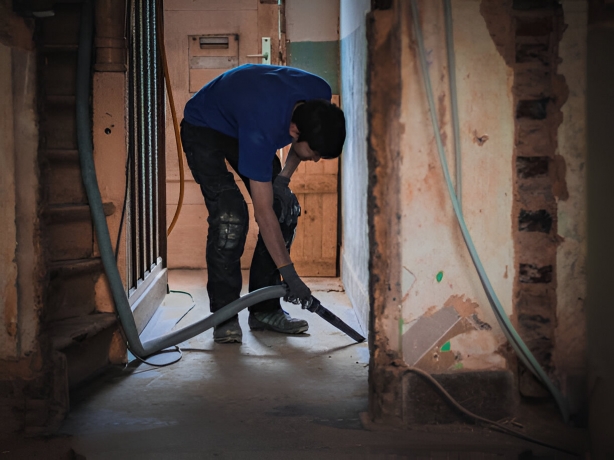 Young professional doing post-construction cleaning