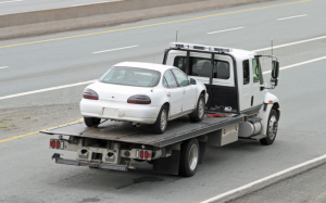 An auto transport carrier carrying a car