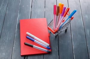 What is the best way to find suppliers for notebooks and pens?