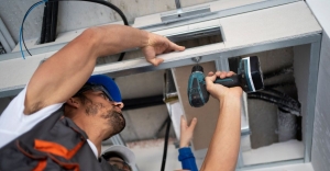 Garage Door Spring Repair: Risks, Costs & When to Hire a Professional