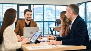 Brisbane business executives discussing IT solution in an office