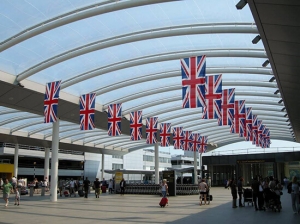 Bolton Airport from the inside. The UK flags are hung from the ceiling of airport building.