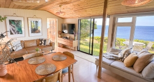 Coastal rental home with solar panels overlooking the Cornish sea