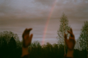Photo by mas_hha: https://www.pexels.com/photo/hands-raised-up-towards-overcast-sky-with-rainbow-11061168/
