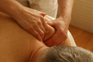 Client receiving a deep tissue massage in a spa
