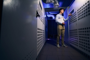man with a file in IT backend