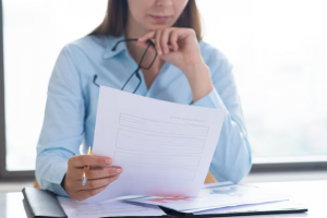 A woman reading a document