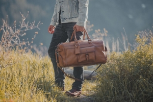 The Timeless Appeal of Leather Duffle Bags and Modern Rolling Travel Bags