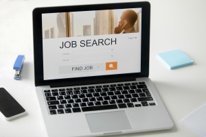 Young professionals applying for jobs online using Jobber website