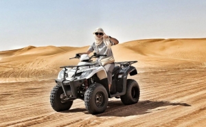 Unleash Adventure in Dubai with Kymco Quad Bike Tours and Buggy Rides