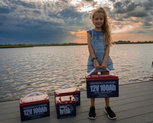 What are the key safety considerations when charging, discharging, and storing lithium marine batteries?