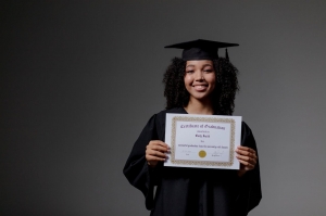 https://www.pexels.com/photo/woman-holding-a-diploma-9829306/