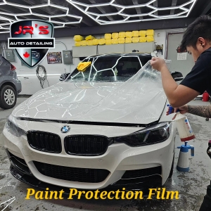 How does 3M Paint Protection Film shield against environmental elements and road debris?