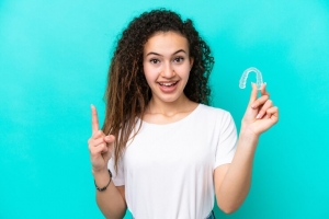 Should You Do Invisalign or Implants First?