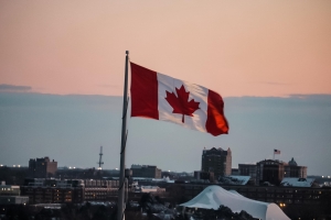 Canadian flag over one of the cities.