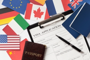 Detailed paperwork for Canadian immigration process, highlighting the role of Canada immigration consultants in Kochi in managing documents and forms.