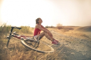 a woman sitting outdoors.