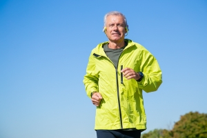 Confident middle-aged man enjoying an active lifestyle, showcasing the benefits of the best testosterone replacement therapy