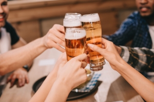 friends having craft beer in pub