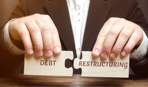 What are the main strategies for restructuring corporate debt?